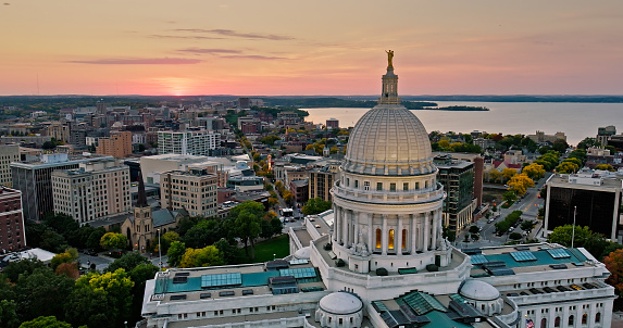 Aerial view of the Wisconsin State Capitol building in downtown Madison, the capital city of Wisconsin, at sunset in Fall.

Authorization was obtained from the FAA for this operation in restricted airspace.