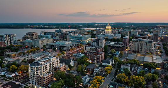 Aerial view of the Wisconsin State Capitol building in downtown Madison, the capital city of Wisconsin, at sunset in Fall.\n\nAuthorization was obtained from the FAA for this operation in restricted airspace.