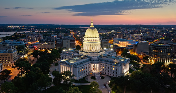 Aerial view of the Wisconsin State Capitol building in downtown Madison, the capital city of Wisconsin, at dusk in Fall.\n\nAuthorization was obtained from the FAA for this operation in restricted airspace.