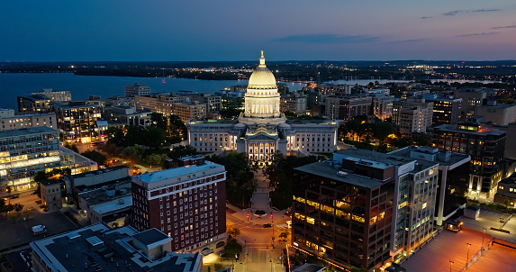 Aerial view of the Wisconsin State Capitol building in downtown Madison, the capital city of Wisconsin, at twilight in Fall.

Authorization was obtained from the FAA for this operation in restricted airspace.