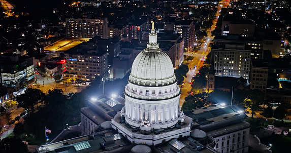 Aerial view of the Wisconsin State Capitol building in downtown Madison, the capital city of Wisconsin, at night in Fall.

Authorization was obtained from the FAA for this operation in restricted airspace.