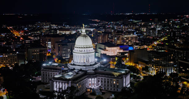 Aerial View of Wisconsin State Capitol on a Fall Night in Madison Aerial view of the Wisconsin State Capitol building in downtown Madison, the capital city of Wisconsin, at night in Fall.

Authorization was obtained from the FAA for this operation in restricted airspace. lake monona photos stock pictures, royalty-free photos & images