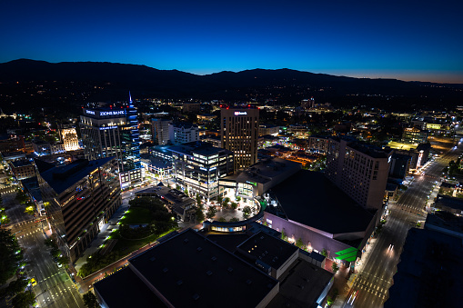 Aerial shot of downtown Boise, Idaho in pre-dawn twilight.\n\nAuthorization was obtained from the FAA for this operation in restricted airspace.