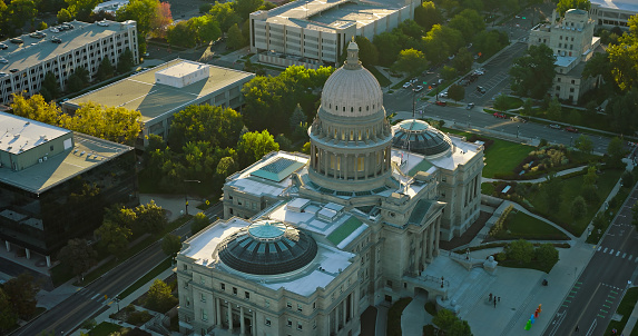 Aerial shot of the Idaho State Capitol building in downtown Boise at sunrise on a Fall morning.\n\nAuthorization was obtained from the FAA for this operation in restricted airspace.