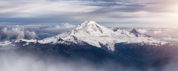istock Mt Baker covered in snow and clouds. Aerial landscape nature background. 1812402664