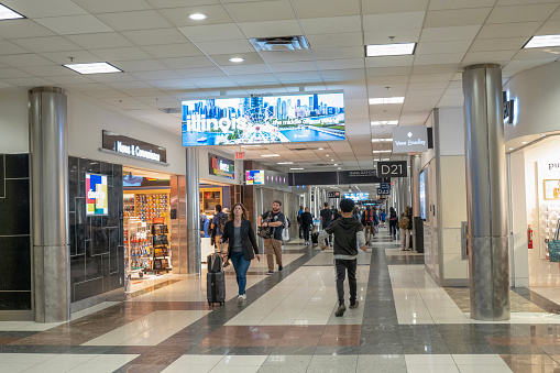 Atlanta, USA - April 23, 2023. Passengers walking in the terminal of Atlanta Hartsfield-Jackson International Airport, Atlanta, Georgia, USA