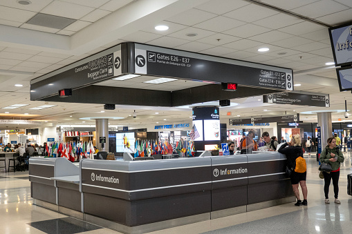 Atlanta, USA - April 23, 2023. Passengers at information desk  in the terminal of Atlanta Hartsfield-Jackson International Airport, Atlanta, Georgia, USA