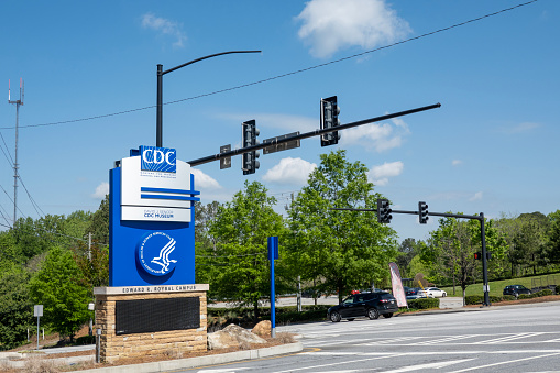 Atlanta, USA - April 15, 2023. Sign of CDC Edward R. Roybal  Campus at the traffic lights, Atlanta, Georgia, USA