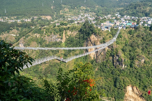 A suspension bridge with bungee jumping across a deep gorge in Kushma, Nepal.