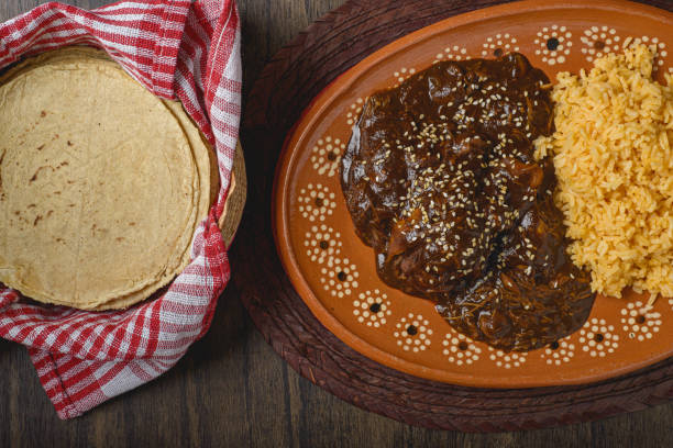istock Mole, typical Mexican food. Traditional Mexican dish served in a clay dish. 1812504906