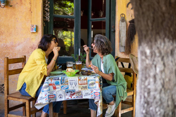 Two female tourists in a local restaurant in Buenos Aires stock photo