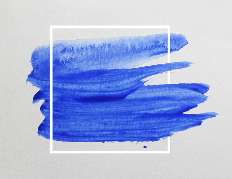 blue watercolor on white paper background