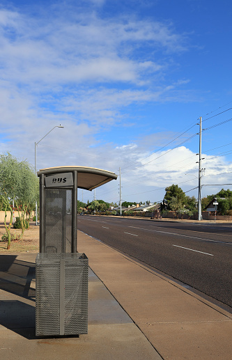 Valley metro transportation bus stop along city avenue at sidewalk in Phoenix, Arizona