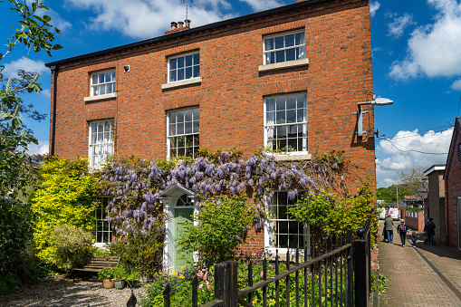 Georgian house with wisteria around the doorway in Oswestry