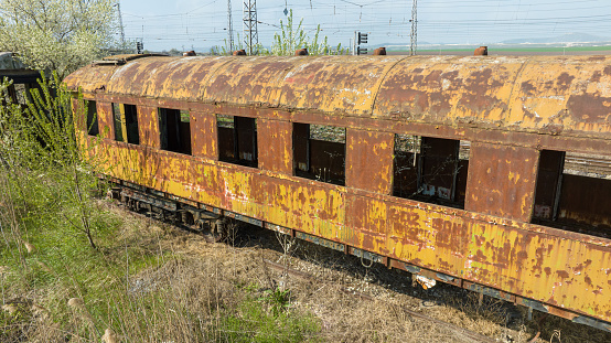 Abandoned old railway wagons at station. Old train wagons