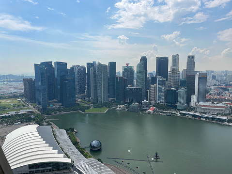 Downtown Core, Singapore - February, 10 2023: Stock photo showing view of skyscrapers in downtown Singapore City, Singapore seen from Marina Bay Sands SkyPark Observation Deck.