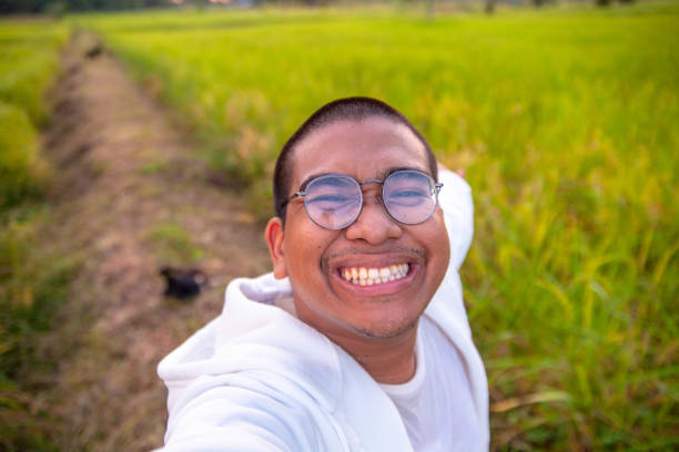 istock cute brown man in rice field 1812685071