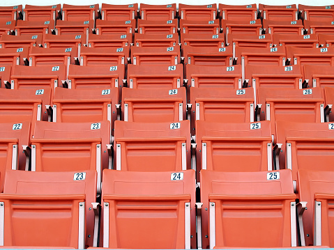 front of plastic folding chairs in sport arena
