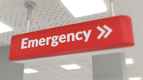 Red emergency sign in a brightly lit hallway. 3d rendering concept of urgency.