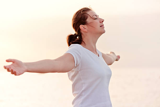 istock beautiful girl enjoying her freedom with open arms 181275721