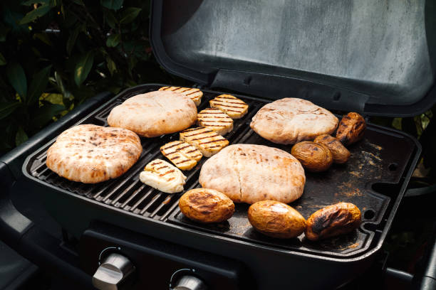 istock Pita bread, grilled cheese and potatoes on the grill 1812781061