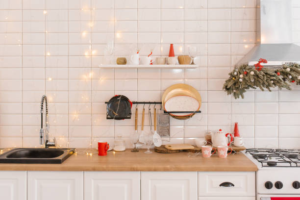 istock Kitchen utensils and Christmas decor in a white cozy kitchen 1812786951