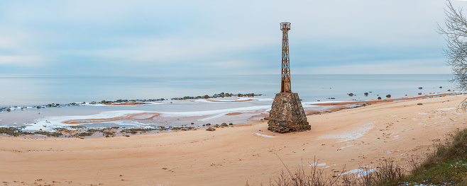 Old ruins of Kurmrags Lighthouse on the shore of the Rigas Gulf, Baltic sea, Latvia