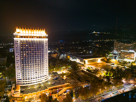 Almaty, Kazakhstan - October 28, 2023: Aerial view of Kazakhstan hotel in Almaty city at night