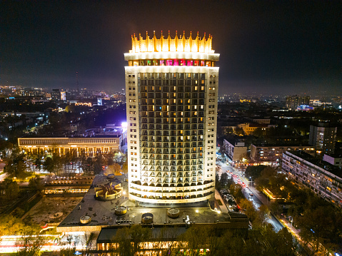 Almaty, Kazakhstan - October 28, 2023: Aerial view of Kazakhstan hotel in Almaty city at night