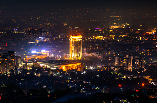 Almaty, Kazakhstan - October 28, 2023: Aerial view of Kazakhstan hotel in Almaty city at night