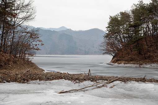 Ice hole for an ice bath in a lake at sunny weather