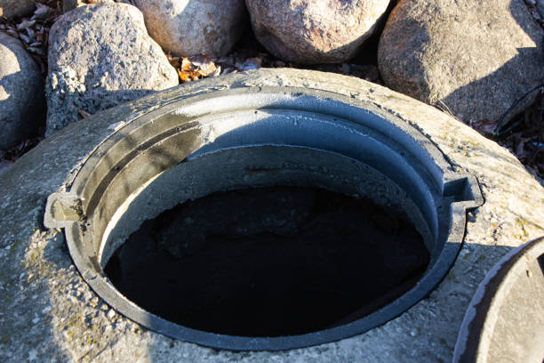 istock Sewer hatch. Open well hatch. Well hatch. Open sewer pit with a hatch 1812867930