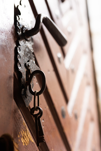 Old Door with Metal Key. Door in a tenement house in the center of Krakow.