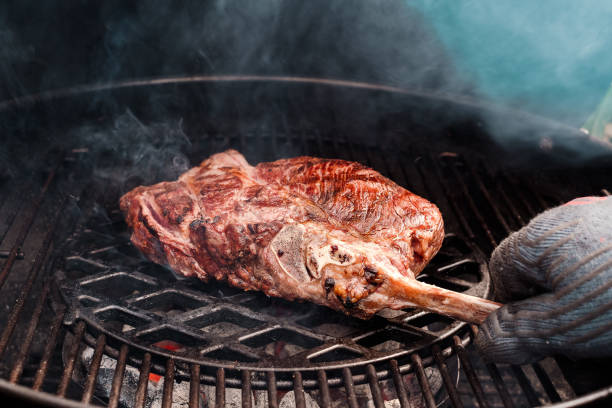 istock Riesiges Tomahawk Steak am Grill - huge Tomahawk Steak on the grill 1812872820
