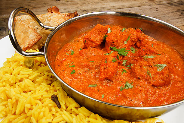 istock Chicken tikka masala in balti dish with rice 181288320