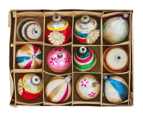 Box of old Christmas tree ornaments isolated with clipping path.