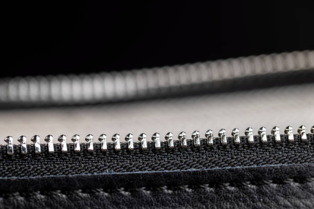 metal zipper on a black leather product, zipper on a black women's handbag close-up