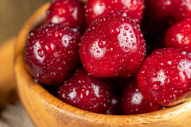 istock covered with drops of water ripe red cherries on the table 1812904708