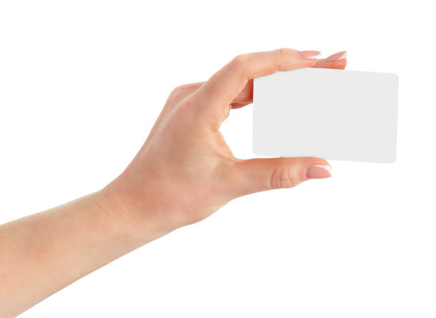 istock Female hand holding white blank card isolated on white with clipping path. 1812923396