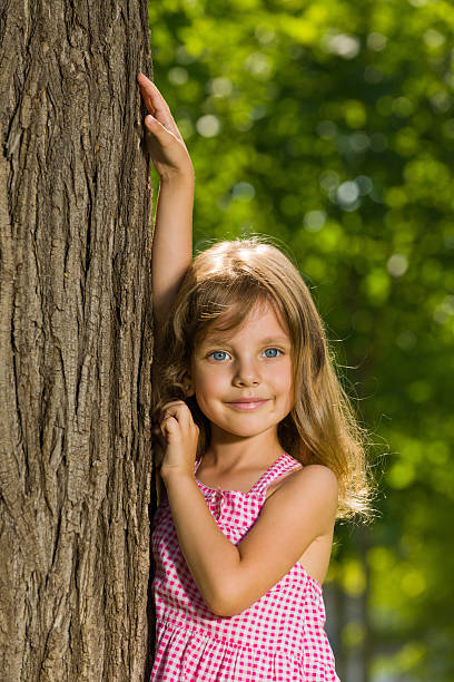 istock Young girl near a tree 181292899