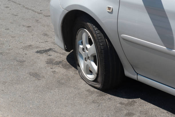 istock Close-up view of front flat car tire. 1812957891