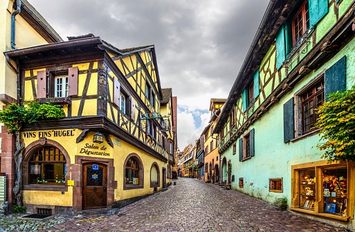 Riquewihr, France, October 14, 2020: View of a narrow street in the Alsatian town of Riquewihr. The town is situated on the Alsatian Wine Route.