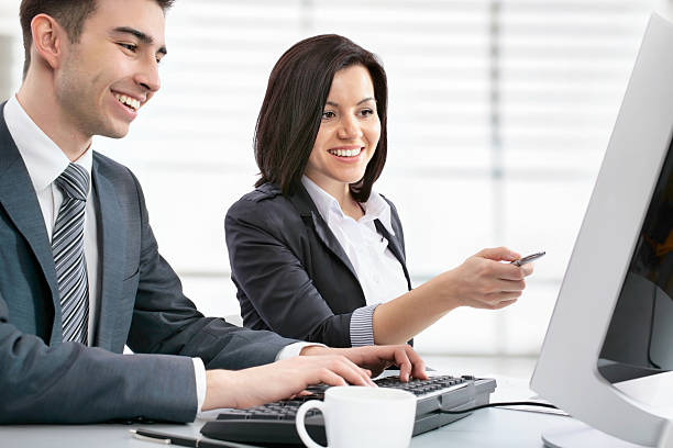 istock Two business people working in front of the computer 181300422