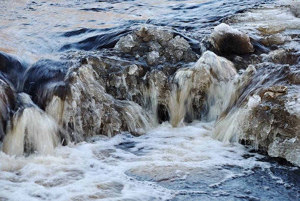 istock waterfall, foaming and splashing waves of a river 181300459