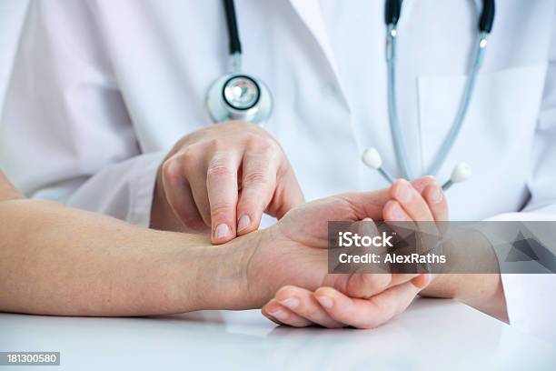 Measuring Of Pulse On Wrist Stock Photo - Download Image Now - Taking Pulse, Examining, Adult