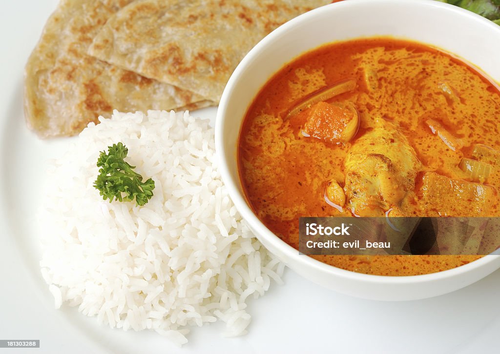 Pollo al curry con arroz y roti - Foto de stock de Alimento libre de derechos