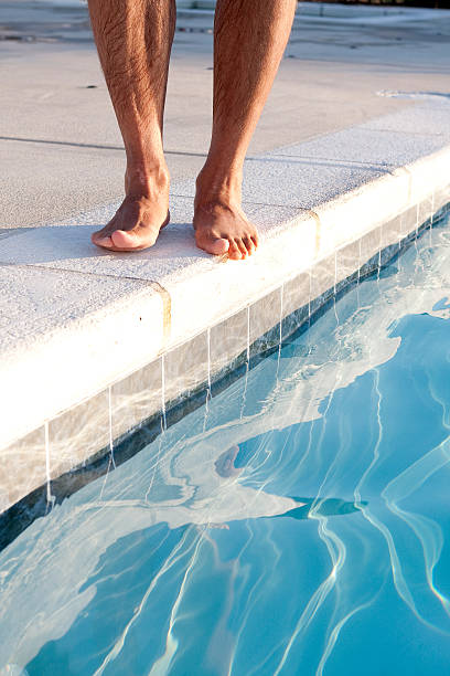 istock Feet At The Swimming Pool 181303895