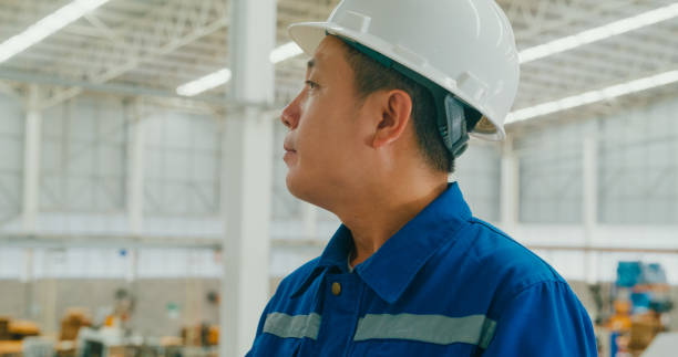 istock Professional Asian male industrial engineers use tablet while standing in manufacturing factory. Working in manufacturing plant or production plant. 1813062654