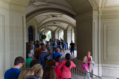 People queueing at open mile day at City of Bern because of 175 year jubilee of Swiss constitution to get access to Federal Palace on a summer day. Photo taken July 1st, 2023, Bern, Switzerland.