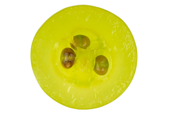 Cross section of green grape isolated in white stock photo